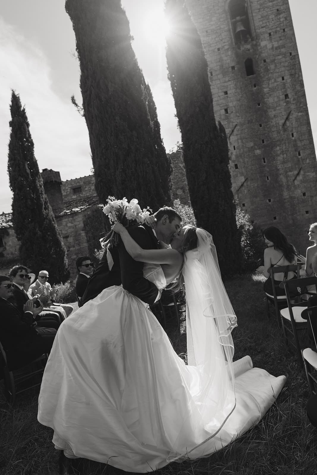 First kiss at a wedding ceremony in Tuscany, Italy