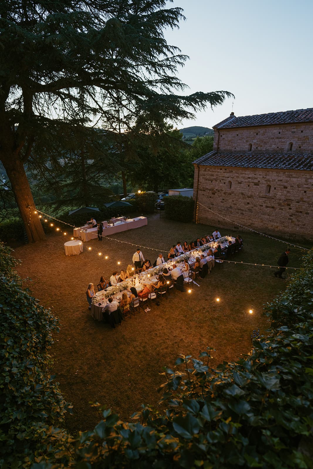 Aerial view of an outdoor wedding dinner in Tuscany, Italy