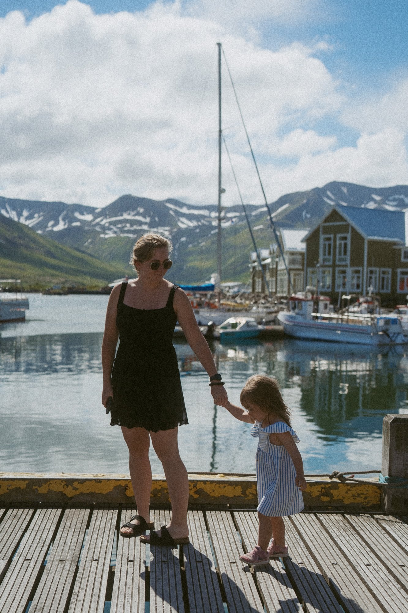 Caroline and her daughter on a harbour dock in Iceland