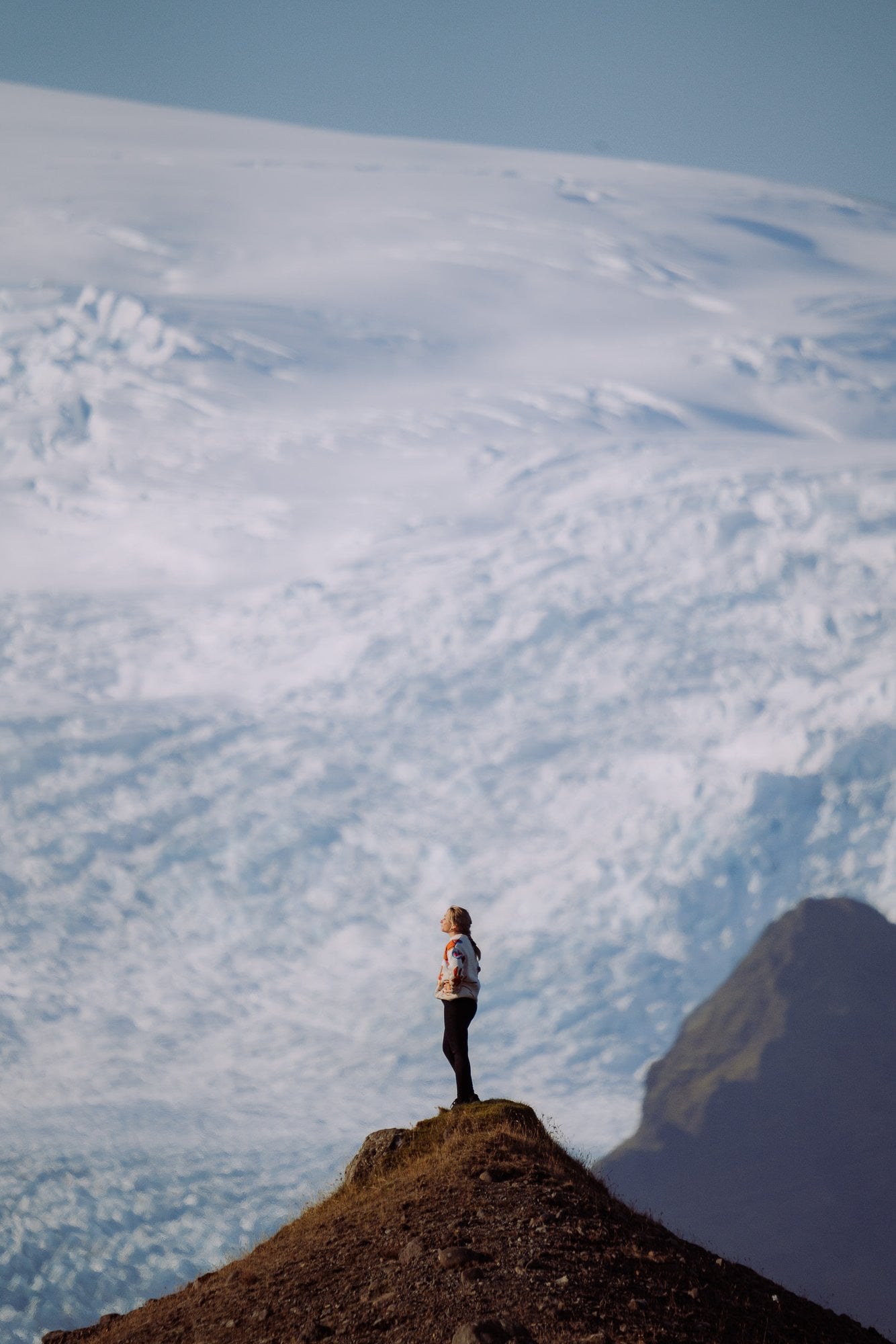 Caroline Vabrit standing above a glacier in Iceland