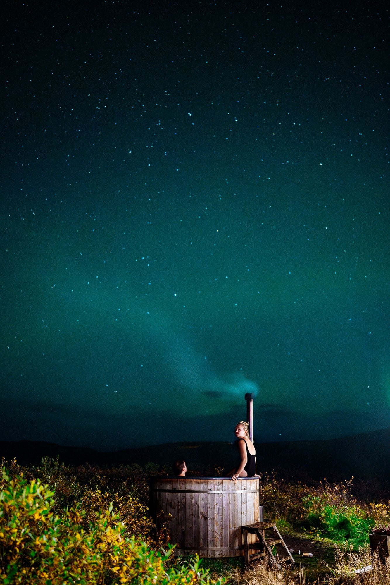 A hot tub under the northern lights in Iceland