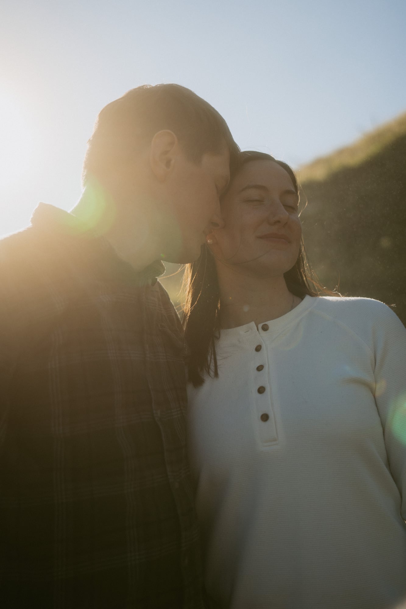 Couple embracing in low Icelandic sun
