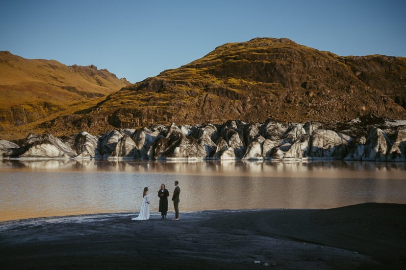 Couple eloping in Iceland at a glacier during a multi-day elopement adventure