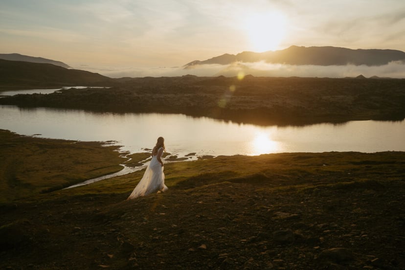 Romantic wedding photo at Selvallafoss waterfall in West Iceland
