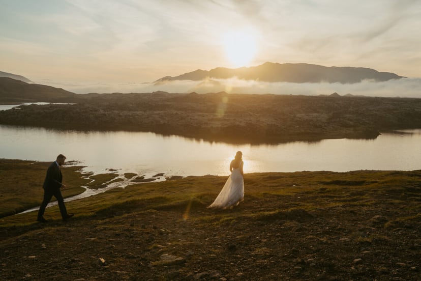 Romantic wedding photo at Selvallafoss waterfall in West Iceland
