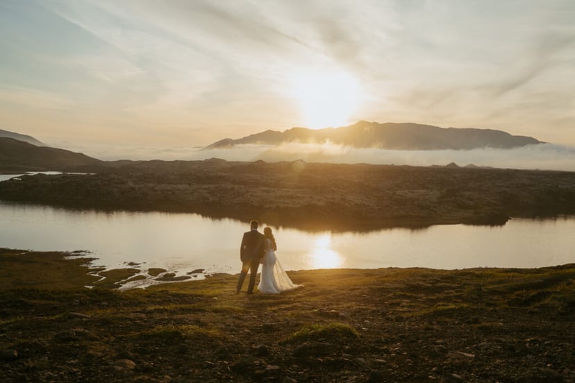 Romantic wedding photo at Selvallafoss waterfall in West Iceland
