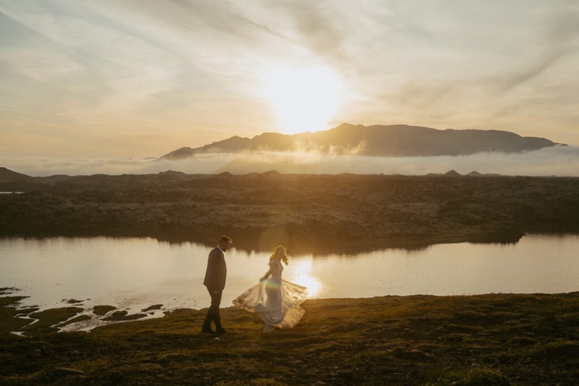 Romantic wedding photo at Selvallafoss waterfall in West Iceland
