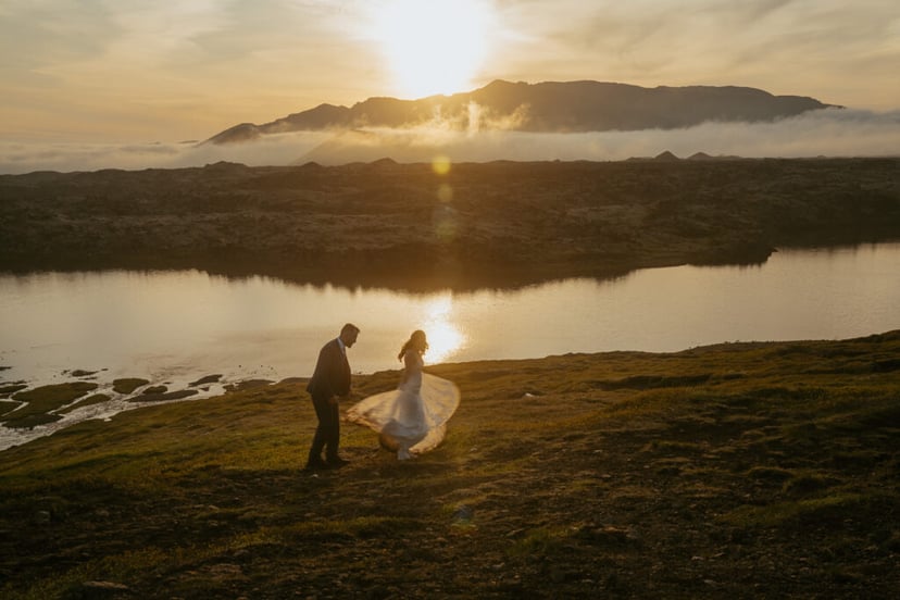 Romantic wedding photo at Selvallafoss waterfall in West Iceland
