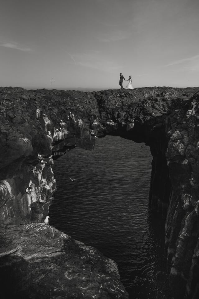 Arnarstapi cliffs couple photo during adventure wedding in Iceland
