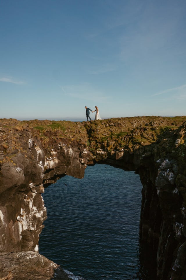 Arnarstapi cliffs couple photo during adventure wedding in Iceland
