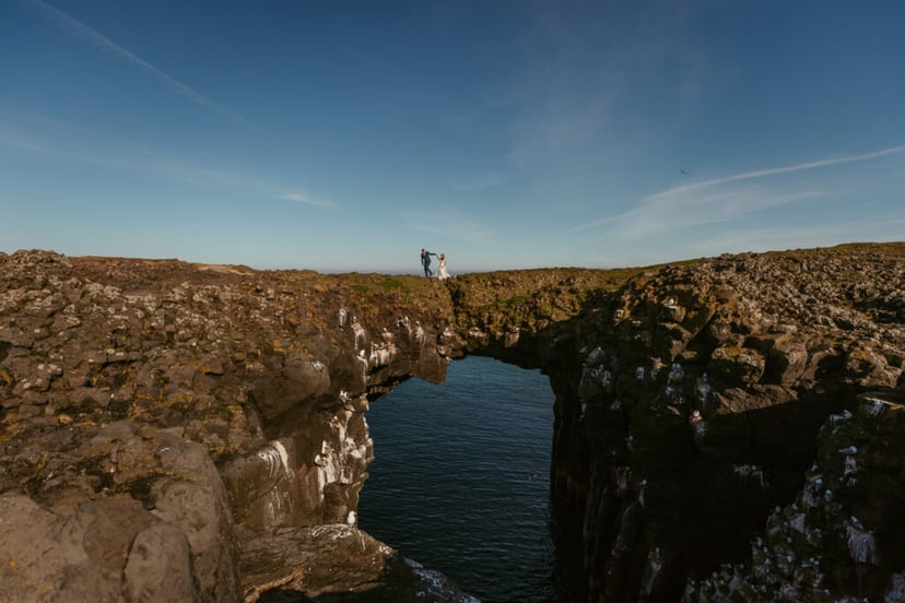 Arnarstapi cliffs couple photo during adventure wedding in Iceland
