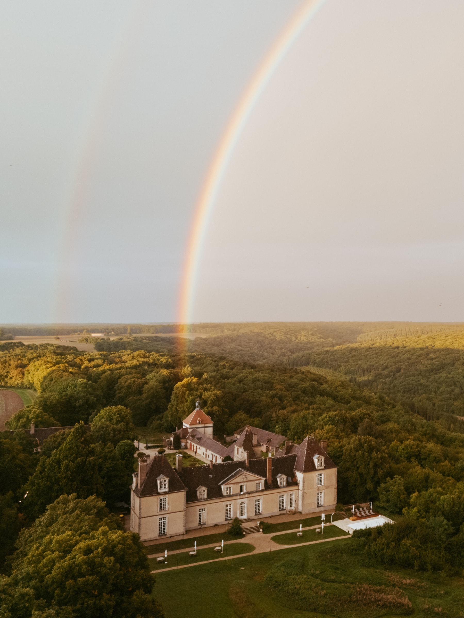 Double rainbow over a chateau in Burgundy, France, the day before a destination wedding