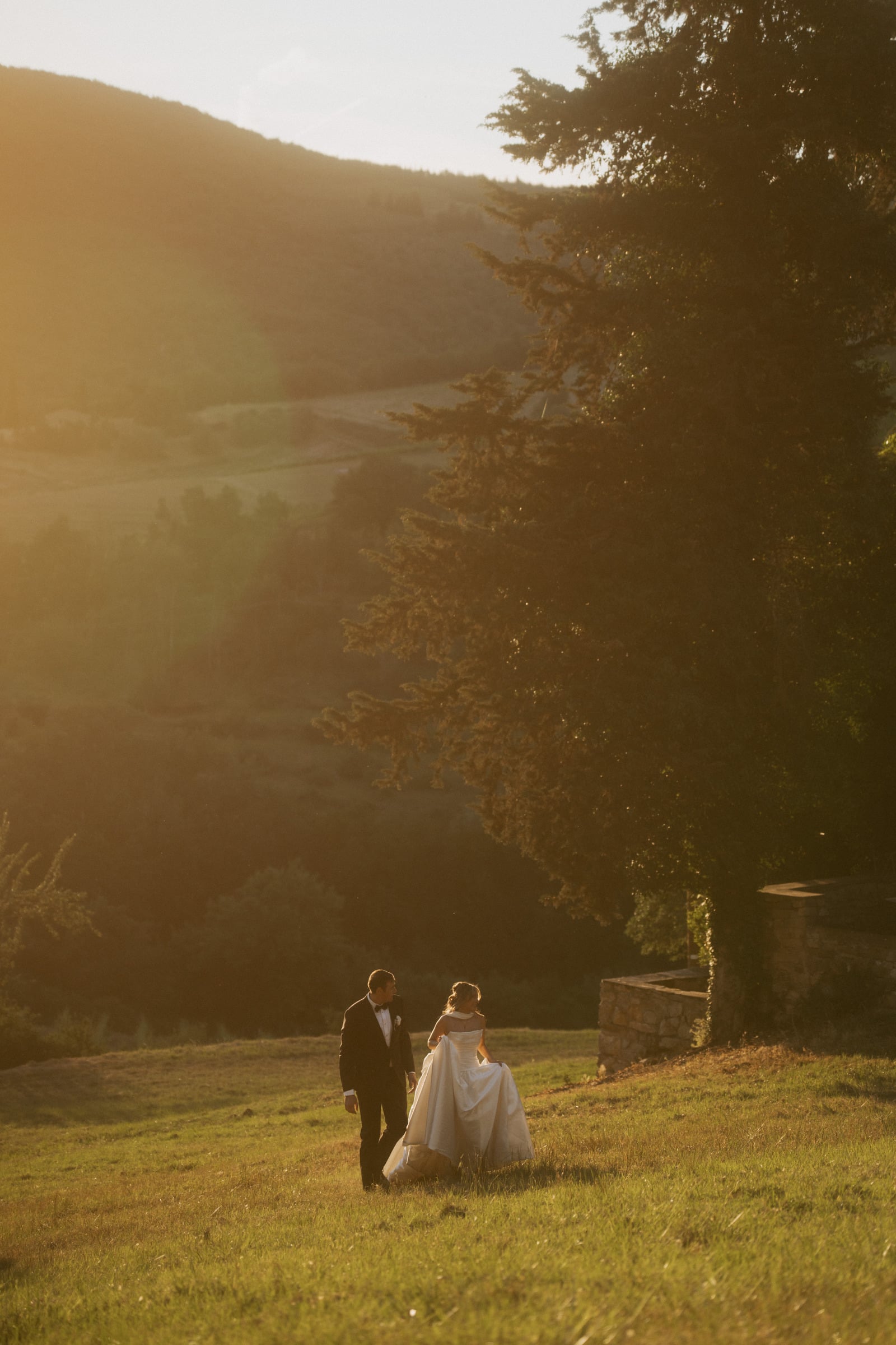 Caroline photographing a destination wedding in the golden hour light
