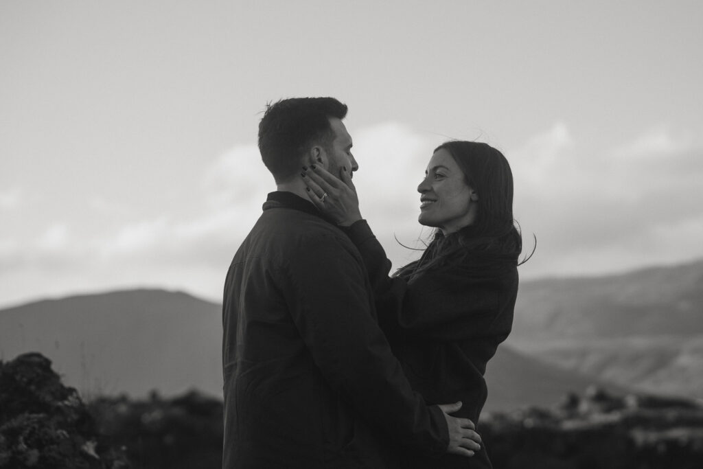 Romantic anniversary moment in front of Búðir’s famous black church on Iceland’s Snæfellsnes Peninsula.