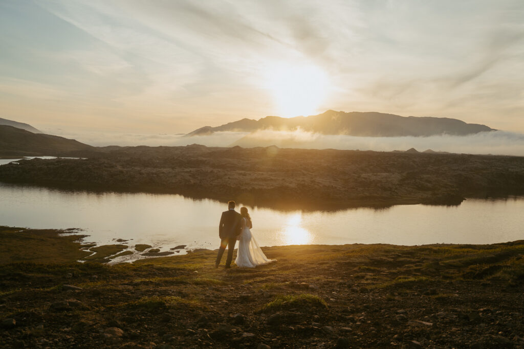 Romantic wedding photo at Selvallafoss waterfall in West Iceland