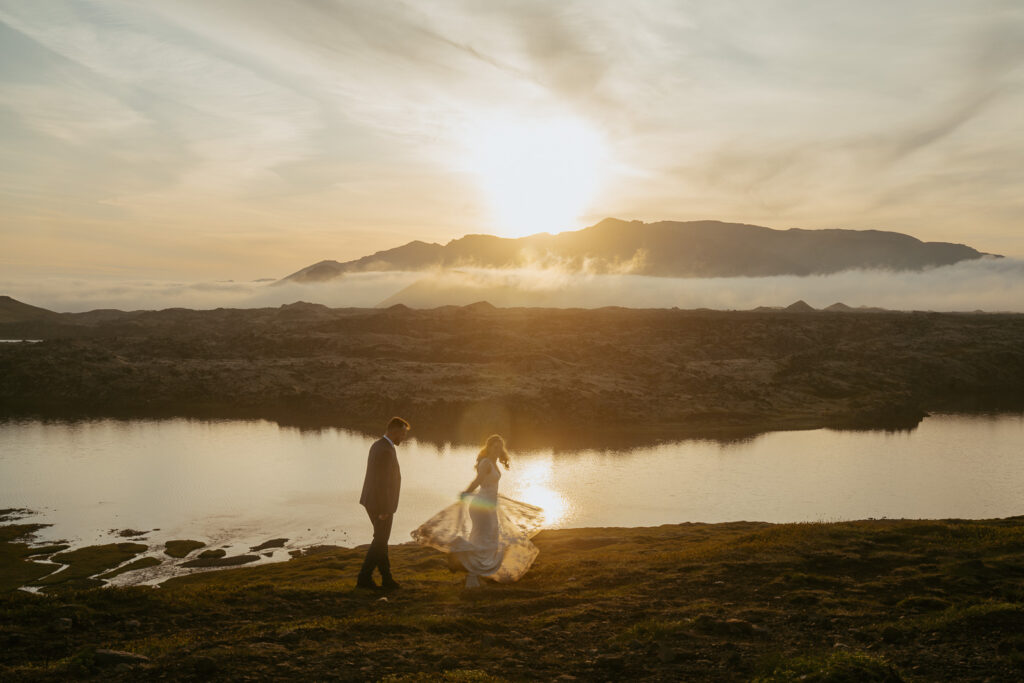 Romantic wedding photo at Selvallafoss waterfall in West Iceland